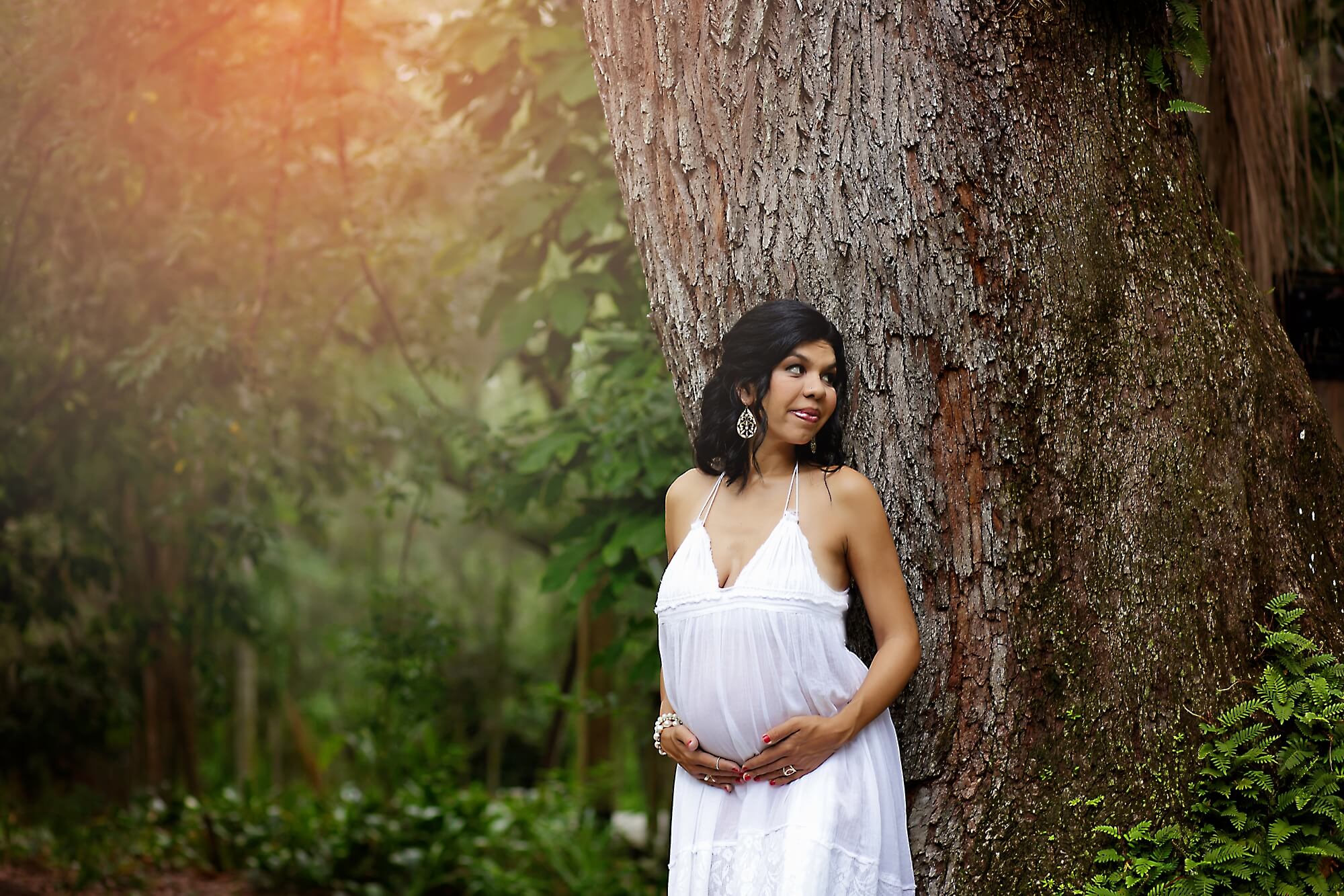 pregnant mom in white dress outdoors
