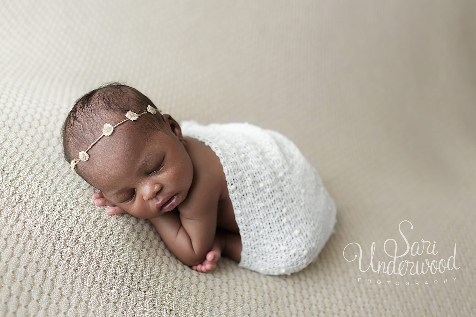 black newborn girl in dainty flower headband