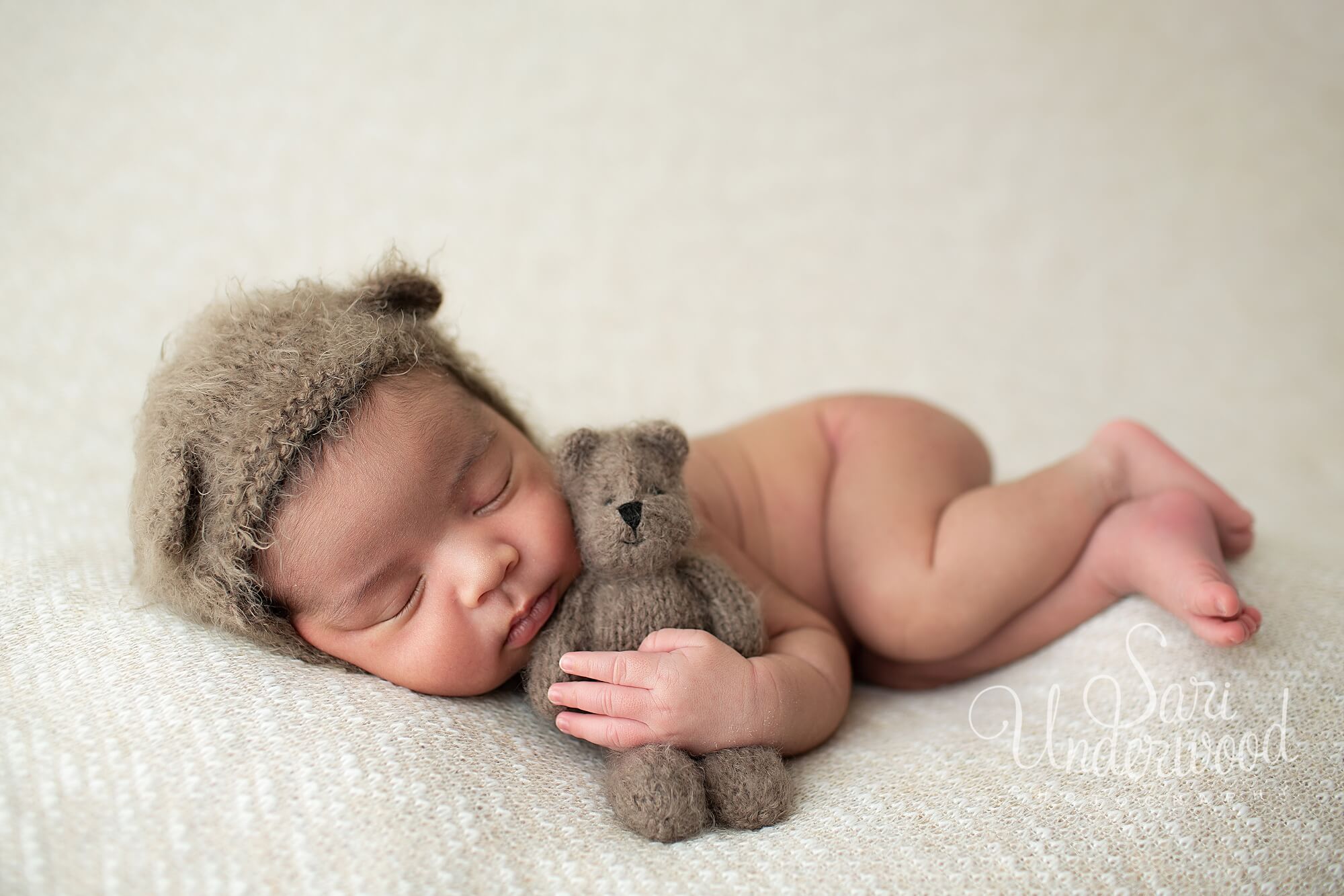 newborn baby boy in bear hat