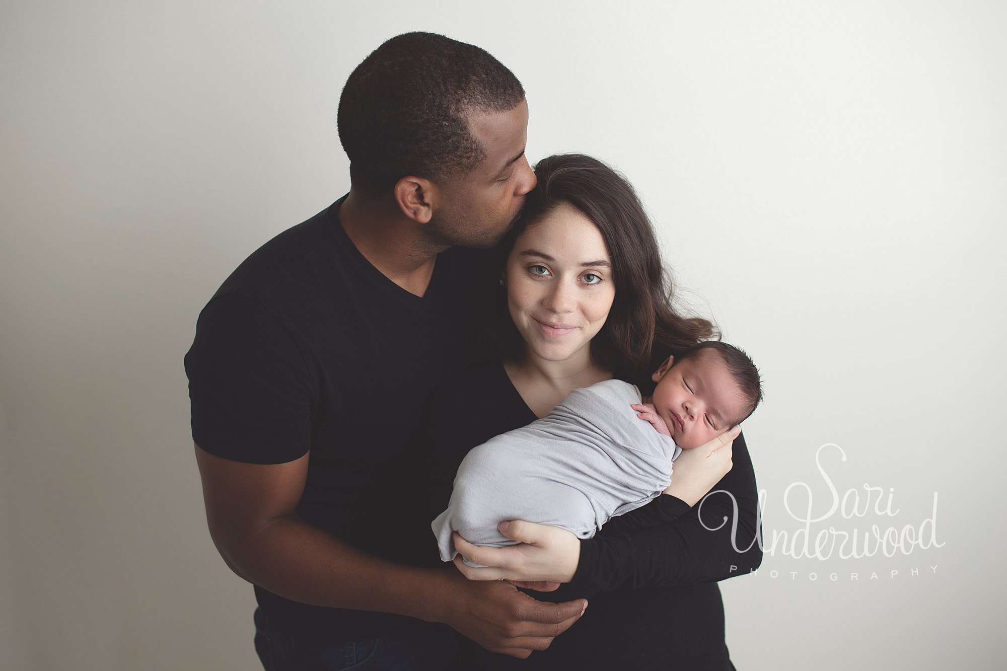 interracial couple with newborn baby boy